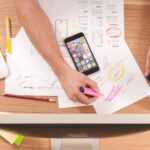 Man using highlighter to mock up website design