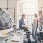 Young Business Professionals Next to Web Development Screen