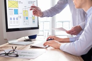 employees working on effective web design mockups for a business website